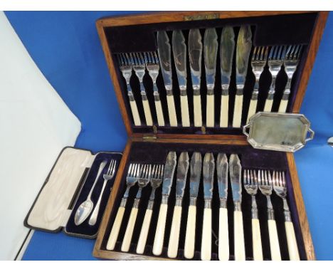 A canteen of fish knives and forks having HM silver collars, cased HM silver christening set and a miniature silver butlers t