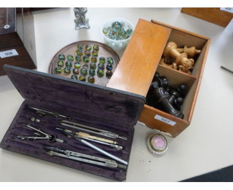 A vintage Solitaire board with marbles, a treen Chess set, an enamel patch box and a drawing instrumental set