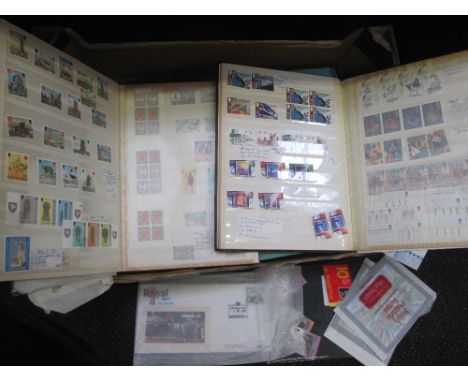 A box containing eleven stamp albums and booklets, GB and Commonwealth interest