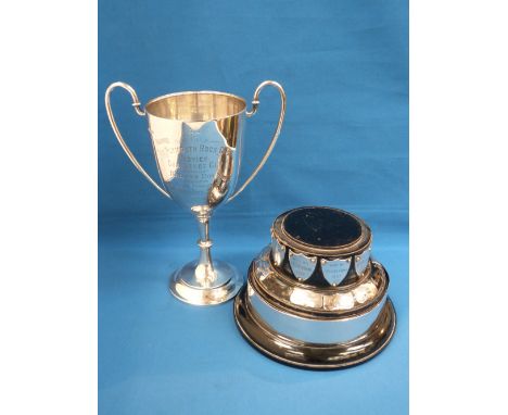 A silver trophy of traditional form having loop handles and inscribed 'The Plymouth Rock Club, 'on a double plinth, Sheffield