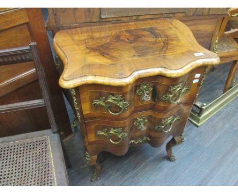 An early 20th century burr walnut and crossband French 3pce bedroom suite having ormolu style applique decoration, comprising