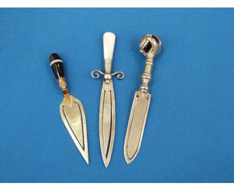 A white metal book mark modelled as a dagger having a mother of pearl handle, another modelled as a trowel having a ring agat
