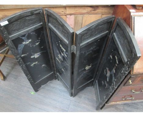 A late Victorian ebonized firescreen having four panels with Shibayama style mother of pearl naturalistic decoration
