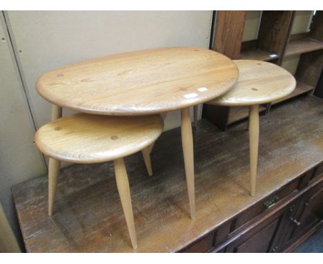 A 1960's Ercol design light elm nest of trio tables