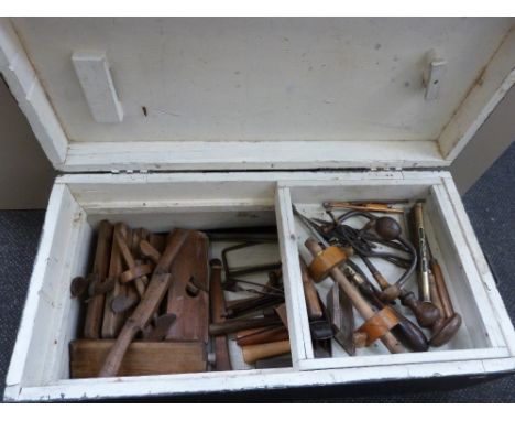 A selection of vintage tools various including brace, wood planes, spirit levels etc in painted tool box