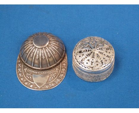 A silver trinket modelled as a jockey's cap having repousse decoration, Sheffield 1971, Francis Howard Ltd and a small white 