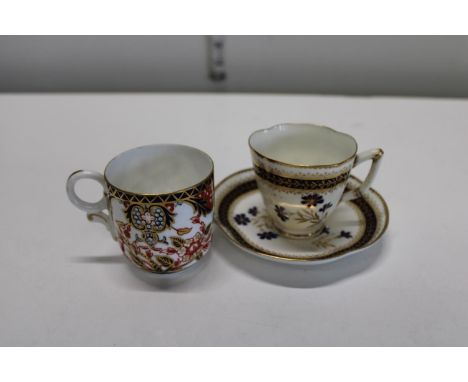 A Royal Worcester cup &amp; saucer &amp; Royal Crown derby tea cup (hairline crack to the Royal Worcester cup) 