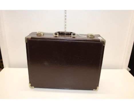 A vintage hard case brown suitcase 