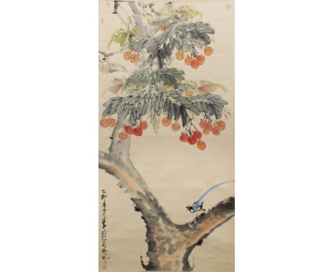 A CHINESE HANGING SCROLL PAINTING, decorated with calligraphy and with an exotic bird perched on a fruit bearing tree, the pa