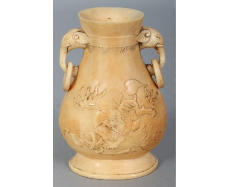 A FINE QUALITY 19TH CENTURY CHINESE IVORY HU VASE, with loose ring elephant-head handles, the sides carved in shallow relief 