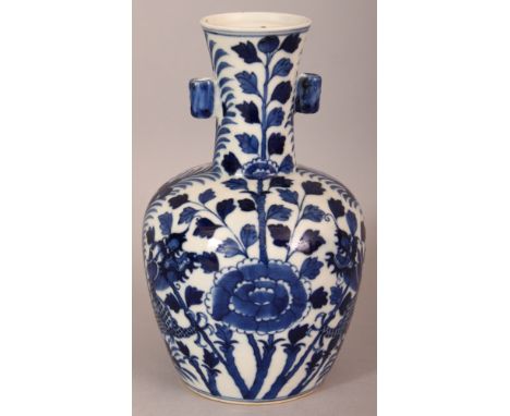 A 19TH CENTURY CHINESE BLUE & WHITE PORCELAIN ARROW VASE, painted with two confronting dragons amidst flowerheads and leafage