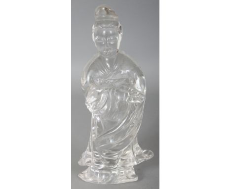 A 20TH CENTURY CHINESE ROCK CRYSTAL CARVING OF GUANYIN, standing in flowing robes and bearing a scroll, 7.8in high.