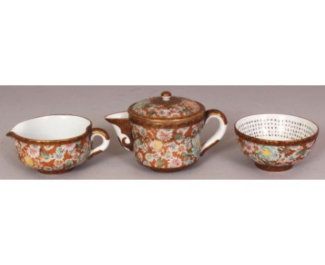 AN EARLY 20TH CENTURY JAPANESE MILLEFLEUR KUTANI PORCELAIN TEAPOT & COVER, with fitted liner, 4.8in long including handle and