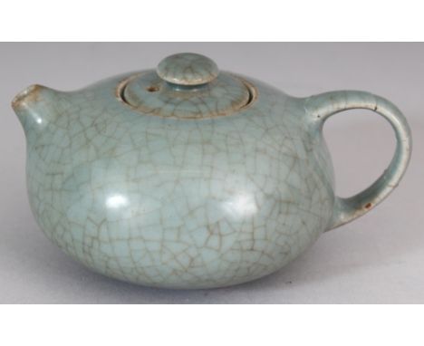 A CHINESE GE STYLE CELADON CRACKLEGLAZE PORCELAIN TEAPOT & COVER, the base with a Yongzheng seal mark, 4.75in long including 