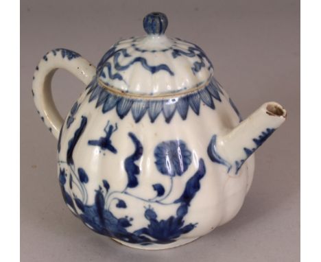 A CHINESE KANGXI PERIOD BLUE & WHITE FLUTED PORCELAIN TEAPOT & COVER, the sides painted with a dragonfly hovering above folia