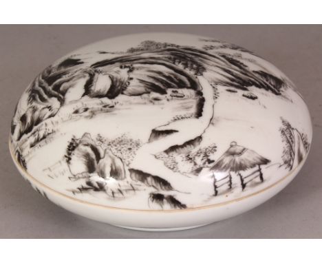 A CHINESE REPUBLIC STYLE CIRCULAR PORCELAIN BOX & COVER, decorated in black enamel with a river landscape setting, the base w