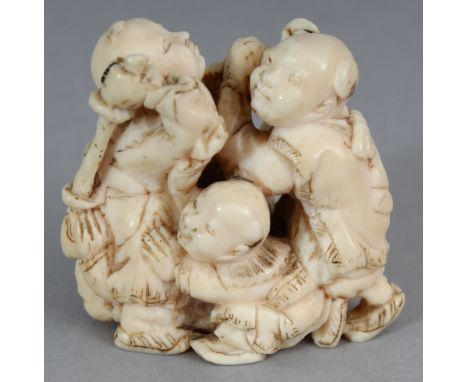 A GOOD QUALITY JAPANESE MEIJI PERIOD IVORY OKIMONO OF A GROUP OF FIVE PLAYING BOYS, unsigned, 1.4in wide at widest point & 1.