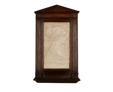 HENRY ALFRED PEGRAM (1862-1937) PORTRAIT OF MILLICENT MARGARET FISHER, CIRCA 1897 plaster relief panel, within the period oak