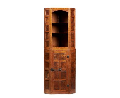 ROBERT ‘MOUSEMAN’ THOMPSON (1876-1955) CORNER CUPBOARD, CIRCA 1930 oak and burr oak, with carved mouse signature and ‘G’Dimen