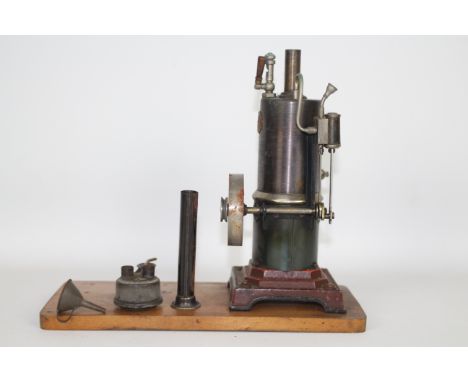 Marklin - A Marklin circa 1932 Vertical Stationary Steam Engine. The engine is mounted on a scratch built wooden board, and a