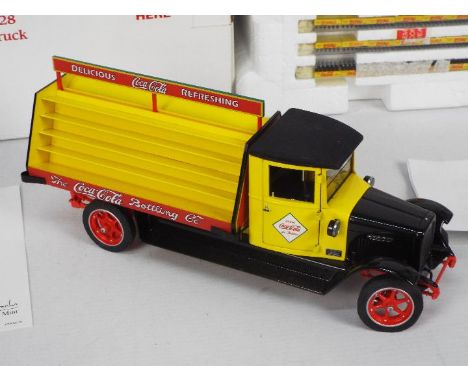 Danbury Mint - A boxed 1:24 scale #127-004 'Replica of the 1928 Coca Cola Delivery Truck' by Danbury Mint. The model appears 