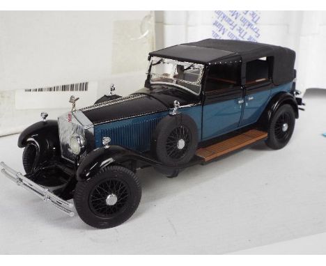 Franklin Mint - A boxed 1:24 scale 1929 Rolls Royce Phantom I Cabriolet De Ville. The model appears to be in Near Mint condit