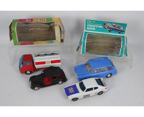 OK Lucky Toys - 4 x vintage plastic models, a boxed Austin 1100 Countryman driving school car, a boxed Esso oil tanker, an un