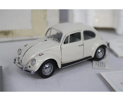 Franklin Mint - A boxed 1:24 scale 1967 Volkswagen Beetle. The model appears to be in Mint condition with swing label attache