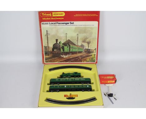 Hornby - A boxed Local Passenger Set # RS607. This contains an 0-4-4 tank engine with two carriages in Southern livery. And a