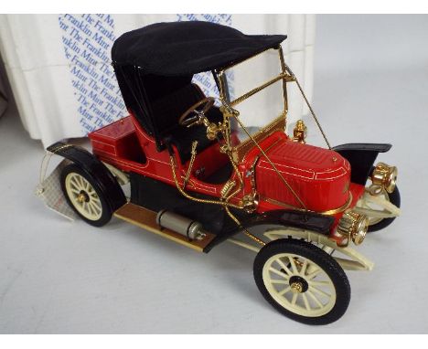 Franklin Mint - A boxed 1:24 scale 1911 Stanley Steamer. The model appears to be in Near Mint condition (missing a side light