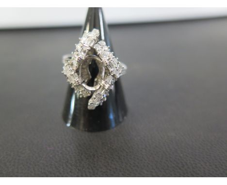 An incomplete diamond cluster ring - The vacant central oval setting to the baguette and single-cut diamond surround to the g