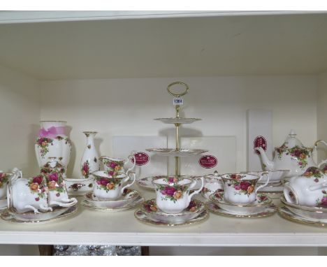 A forty piece Royal Albert - Old Country Roses - tea service with cake stand, vase, six gold plated dessert forks, spoon and 