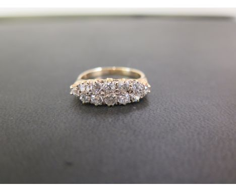 A diamond boat-shape cluster ring - The twelve old-cut diamonds to the tapered shoulders and plain half-band - Estimated tota