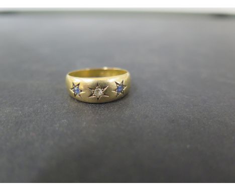 An 18ct gold sapphire and diamond band ring - Hallmarked Chester - Ring size M - Weight approx 2.0gms
Condition Report: Good 