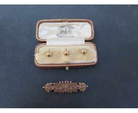 A set of three early to mid 20th century 18ct gold dress studs - In a James Aitchinson fitted case - Weight approx 2.7gms - T