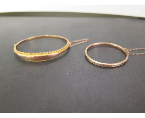 A 9ct gold hinged bangle - With bead detail - Hallmarked Birmingham, 1909 - Inner diameter 6cms - Together with a child's 9ct