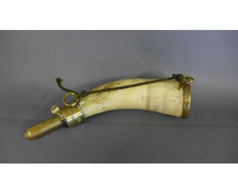 A late 18th century single curve horn and brass powder flask engraved to top with alpha numerical cipher - Length 25cm Good c