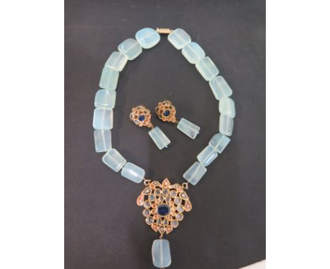 A jade bead necklace suspending a gem-set pendant - Stamped 750 - Length of necklace 47cms - Length of pendant 8cms - Togethe
