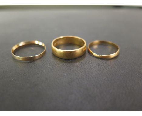 Two 22ct gold band rings - Ring sizes N and O - Hallmarked Birmingham and London - Total weight approx 6.2gms - Together with