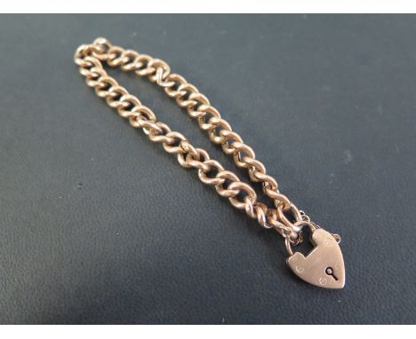 An early-mid 20th century 9ct gold curb-link bracelet - With padlock clasp - Length 18cms - Weight approx 9.9gms
Condition Re