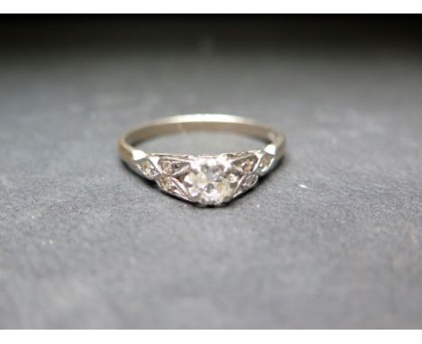 A diamond dress ring - Principal diamond estimated weight 0.40ct - Estimated K-L colour, P1-P2 clarity - Stamped 18ct - Ring 