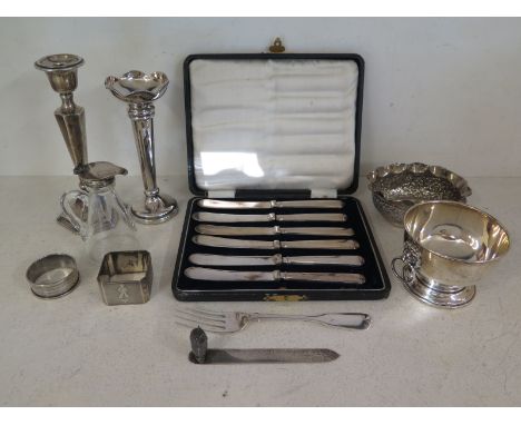 A silver hallmarked bowl with twin lion mask handles, Birmingham 1971-72, two silver napkin rings, silver owl motif bookmark 