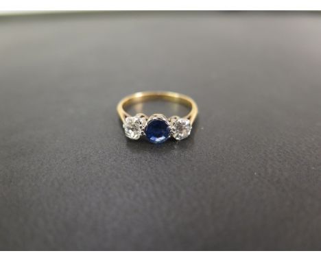 An early to mid 20th century 18ct gold sapphire and old-cut diamond three-stone ring. - Estimated total diamond weight 0.60ct