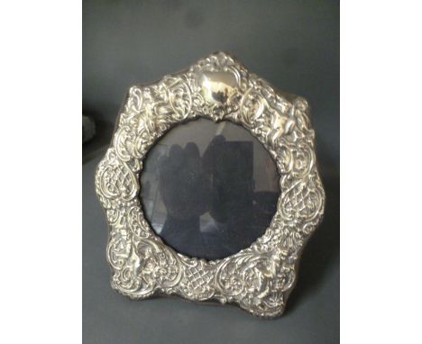 A 20th century silver embossed photo frame - London K F Ld - Height 18cm x Width 16cm 
