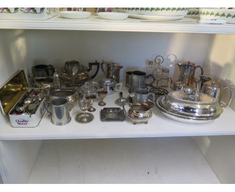 A selection of silver plated items including entree dish, coffee pots, tea pot, milk and sugar, flatware, cruet set etc.
