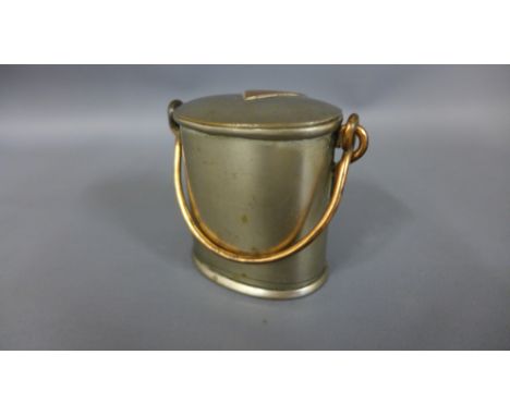 A World War I Trench ware copper and base metal belt canister clip with interior ceramic container 
Condition report: Good, b