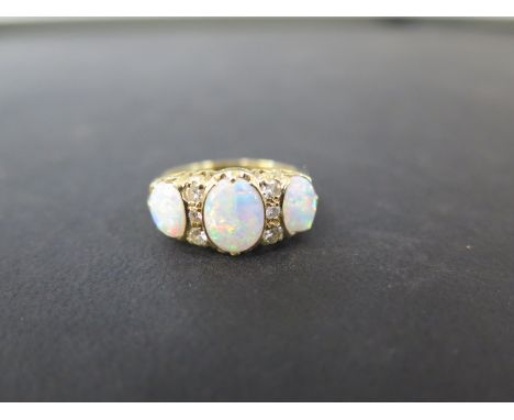 An 18ct gold opal and diamond dress ring - Hallmarked London - Ring size Q - Weight approx 5.7gms
Condition Report: Good to f