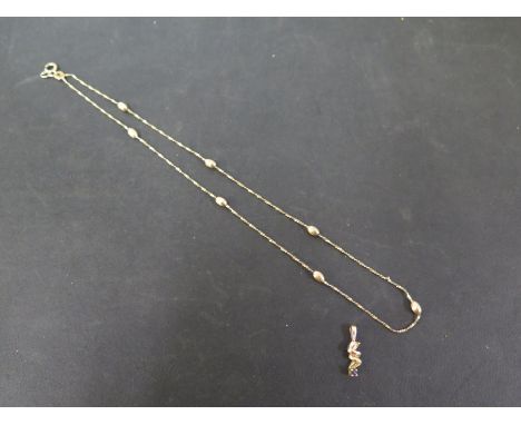 A 9ct gold fancy-link chain - Hallmarked London - Length 41cms  - Together with a 9ct gold sapphire pendant - Hallmarked Lond