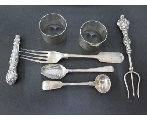 A silver hallmarked fiddle back fork, teaspoon - damaged bowl, small ladle spoon, two napkin rings, silver handled toasting f