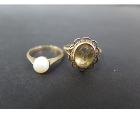 Two 9ct gold dress rings - To include one set with a cultured pearl - Size K - Together with a citrine single-stone - Size L 